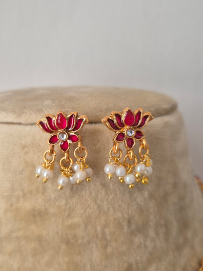 Antique intricate ruby-pink lotus-shaped accents and hanging pearl clusters earrings by naitri.in