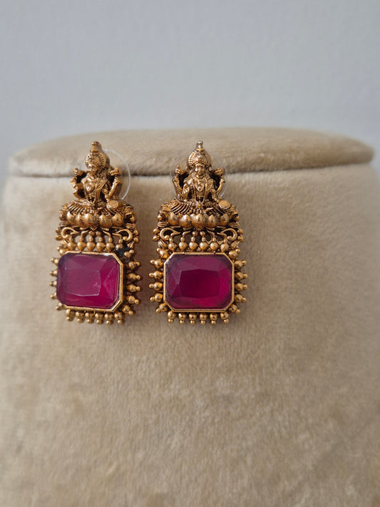 Ruby red gemstone geometric and gold-toned, godess motifs earring stud by naitir.in