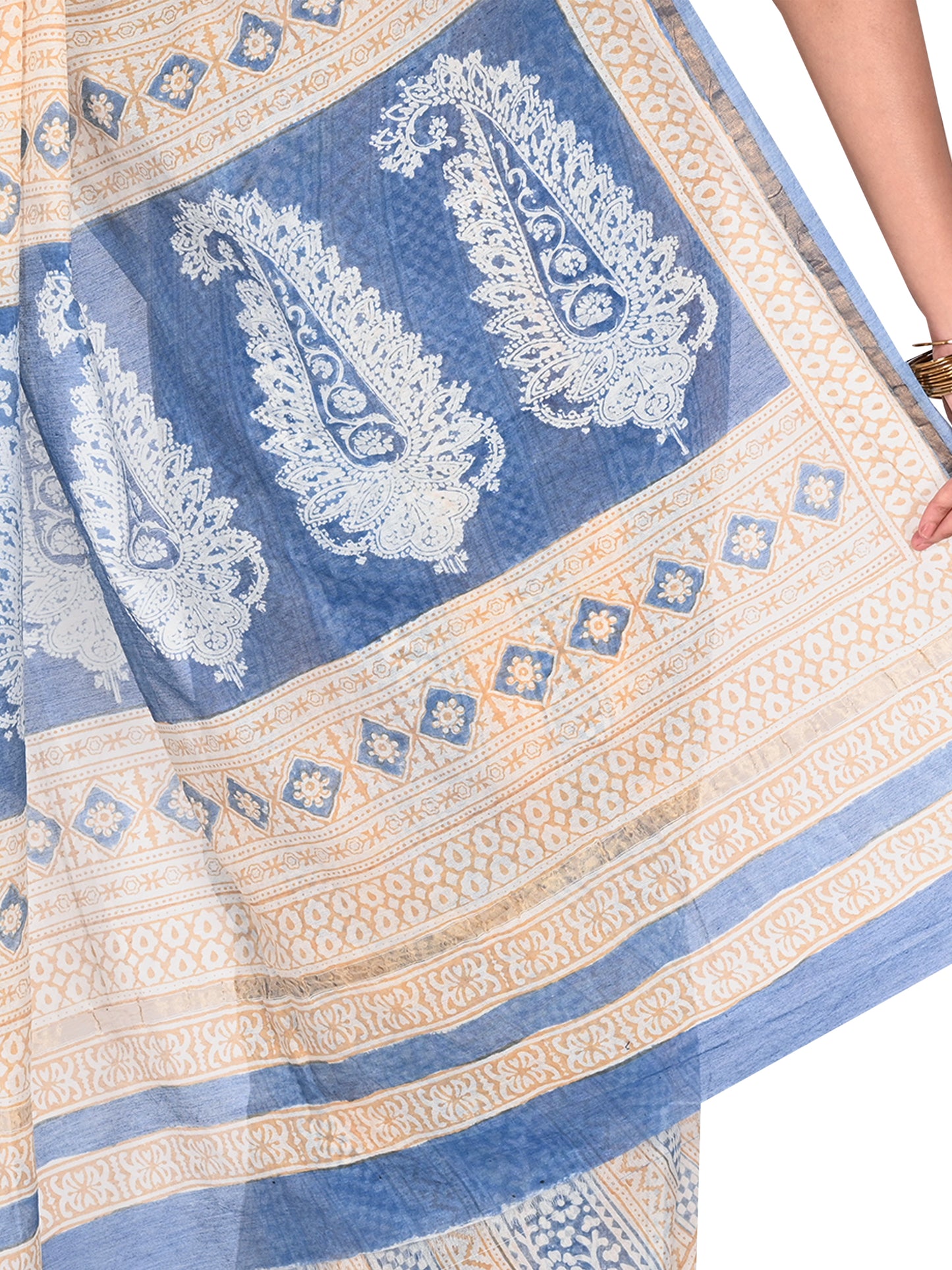 Detailed view of traditional Bagh hand block printing on a beige and blue Maheshwari cotton silk saree featuring a classic drape By naitri.in