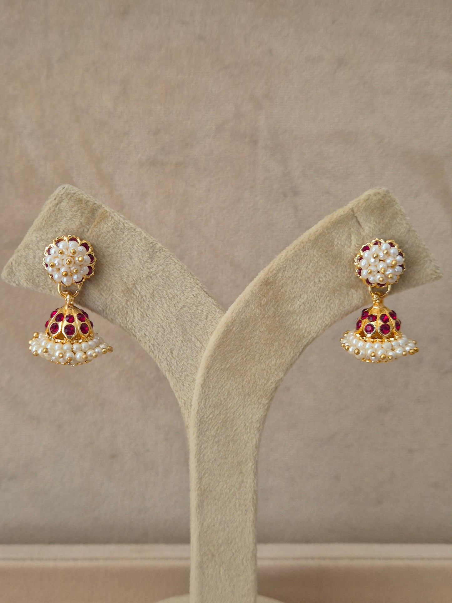Elegant golden statement earrings with traditional ethnic details by naitri.in