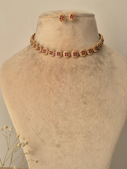 Golden necklace with small flower design by naitri
