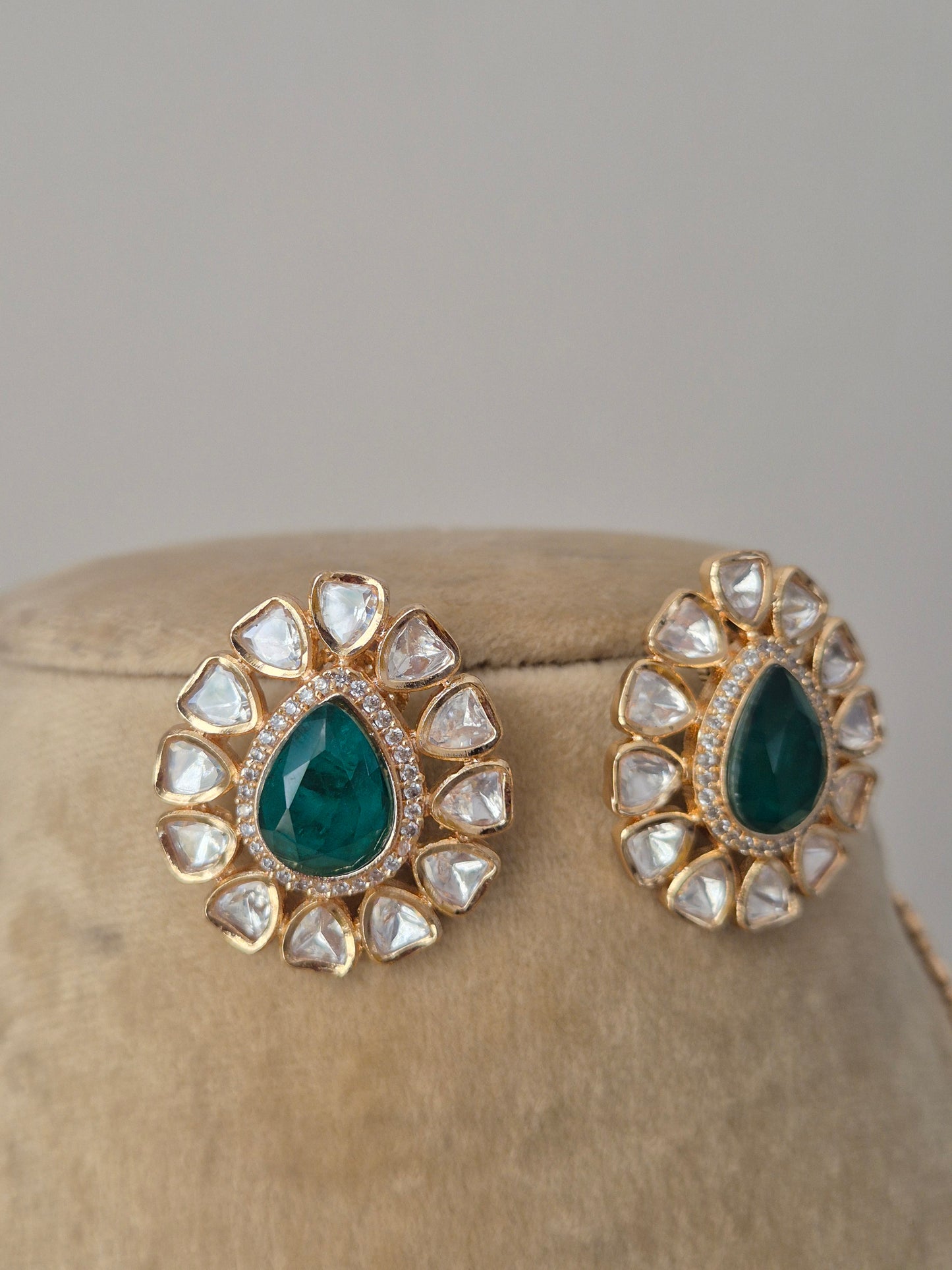 earrings with emerald-green centers  from the Naitri handcrafted collection.