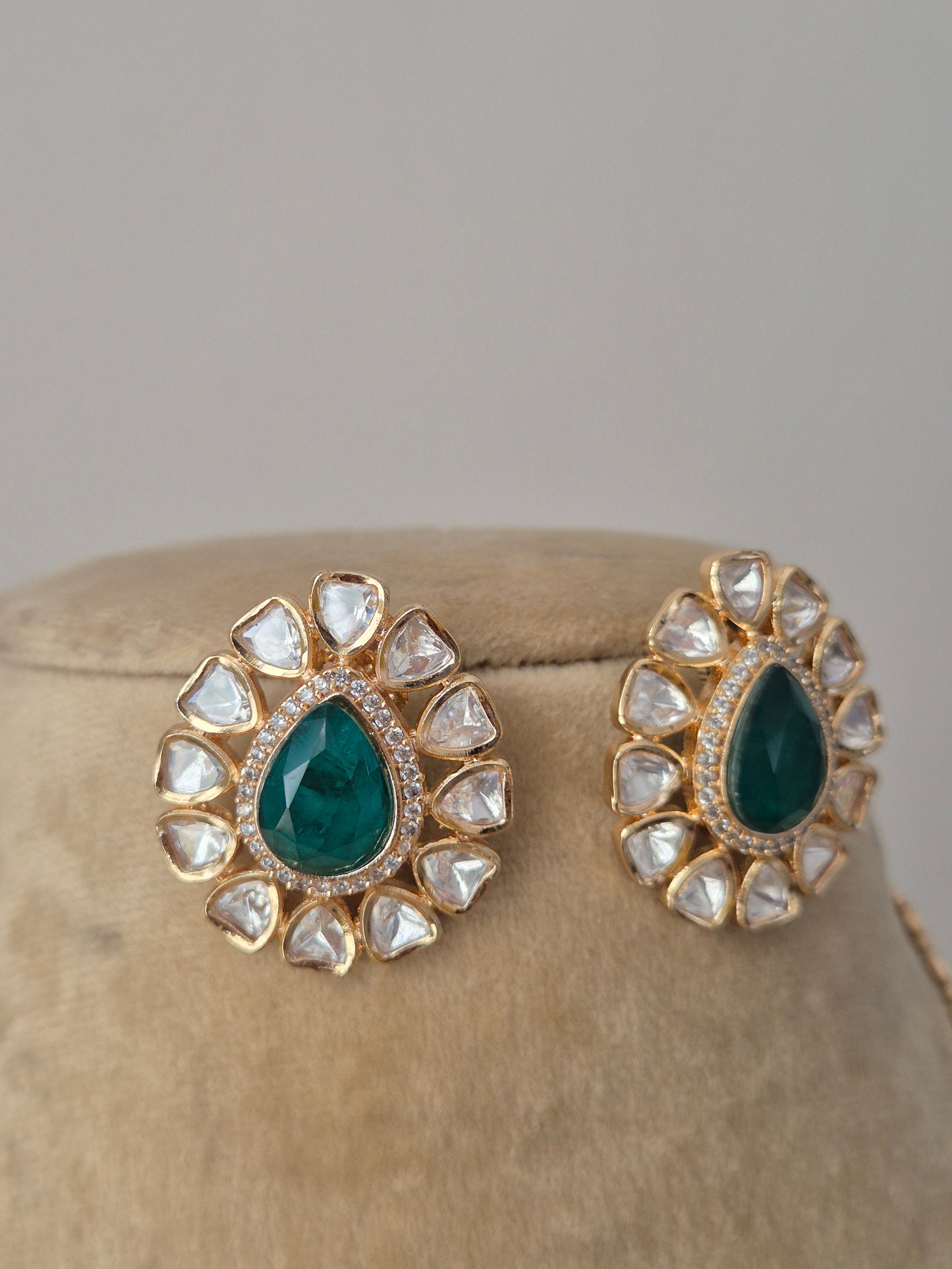 earrings with emerald-green centers  from the Naitri handcrafted collection.