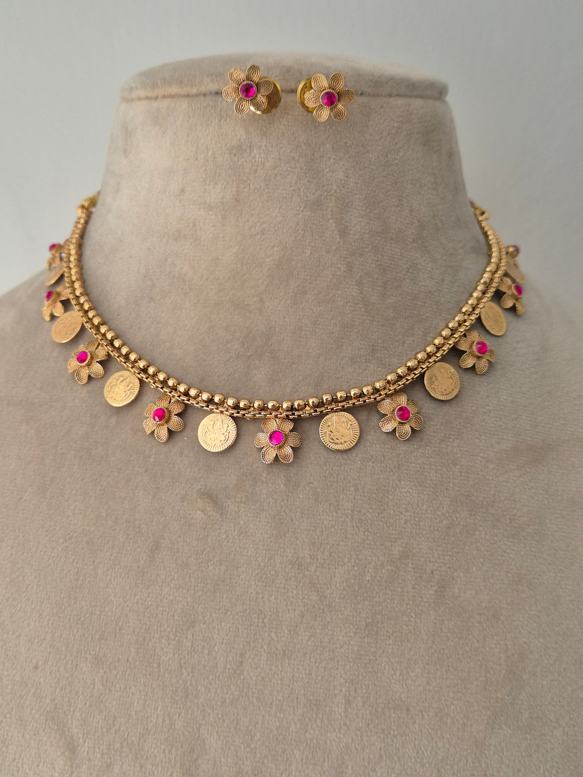 Gold necklace with floral and coin A timeless, breathtaking masterpiece by naitri.in