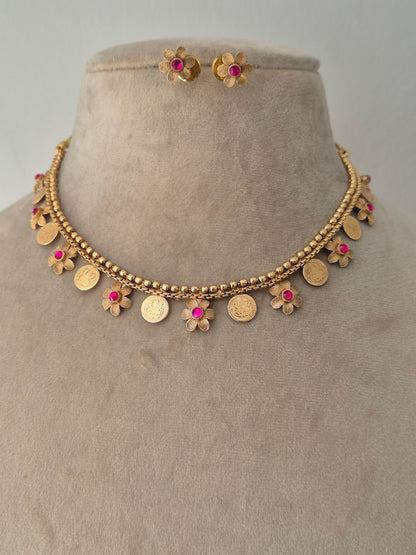 Gold necklace with floral and coin A timeless, breathtaking masterpiece by naitri.in