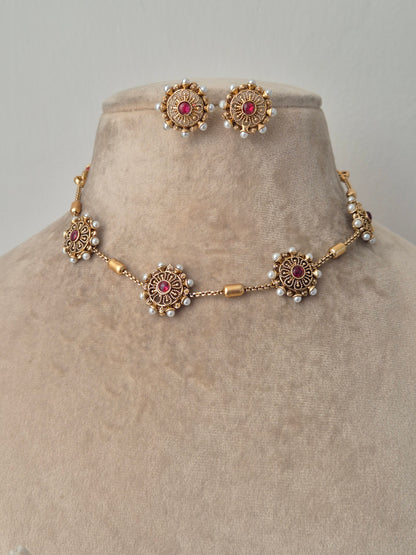 Gold bracelet with red gemstones by naitri.in