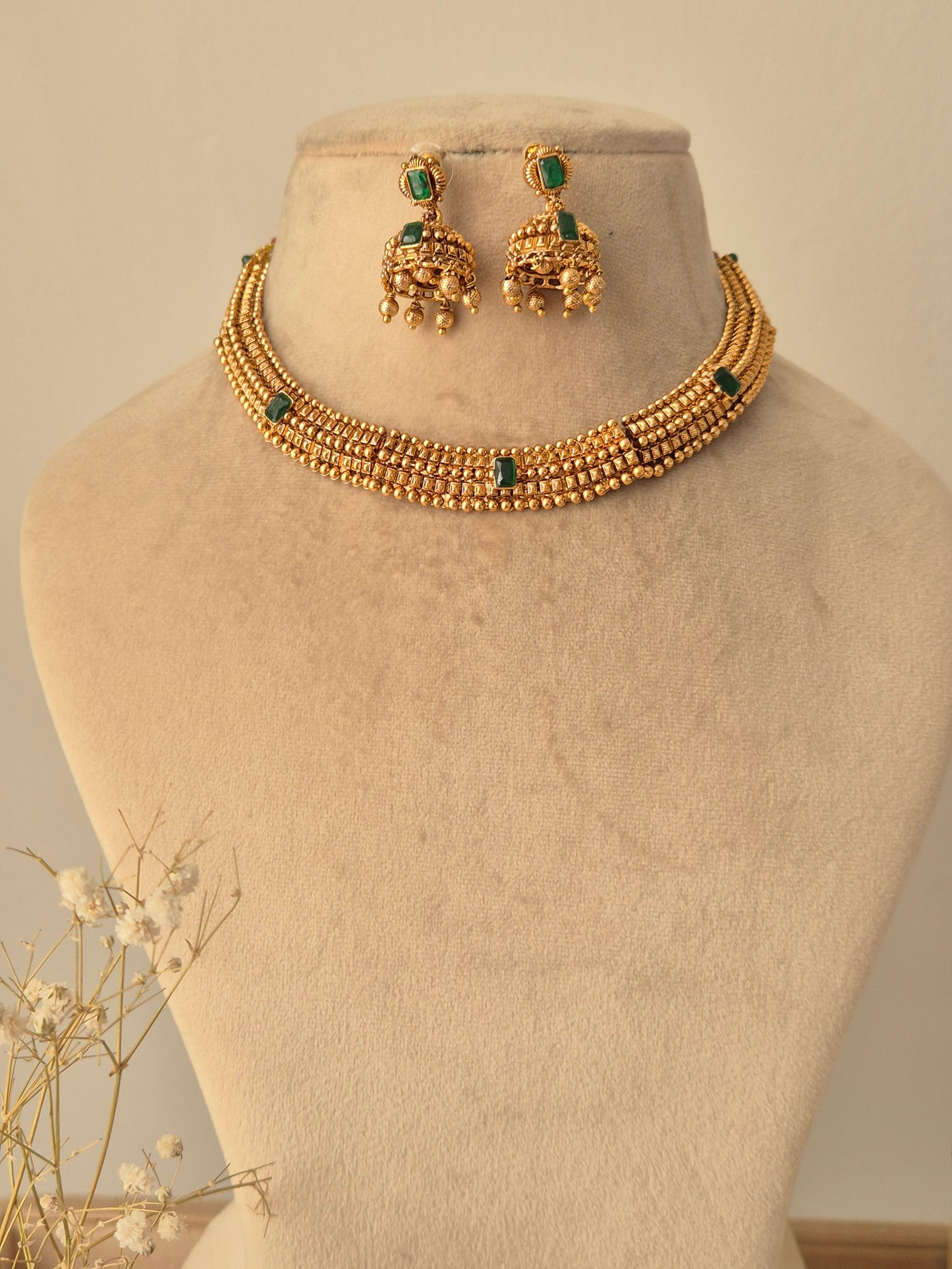 Traditional elegant necklace set with green stones with Jhumki available at naitri.in