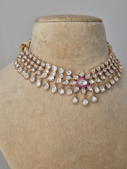"Exquisite Rosalie necklace set featuring a refined finish of American Diamonds and vibrant red stones, perfect for weddings and festive sarees by naitri.in