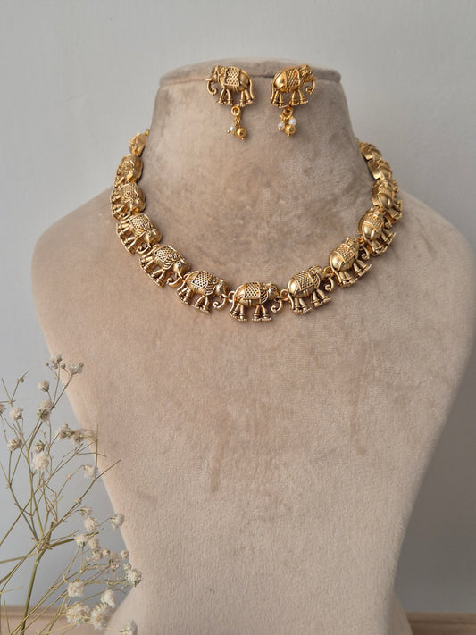 Gold elephant necklace set detailed beautifully carry a symbol of wisdom and strength wherever you go by naitri.in