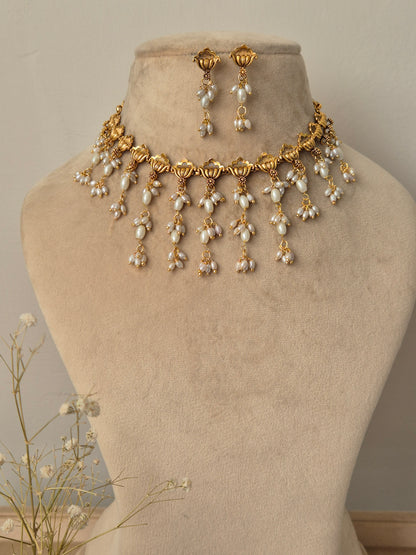 Gold and pearl necklace with same designed earrings, unique flowers shaped necklace by naitri.in