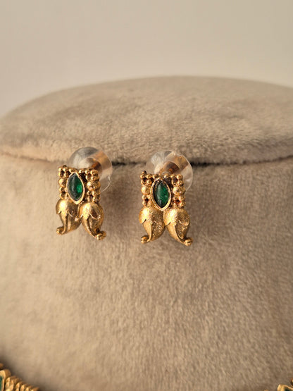 Gold earrings with green stones leaf designed with small gold beads design by naitri.in