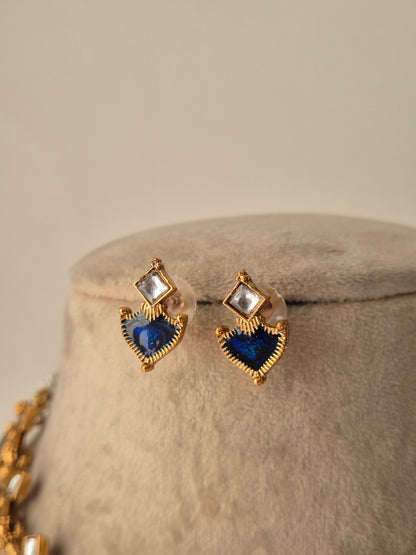 Heart-shaped earrings with blue and clear gemstones delicate Gold-plated Fiya earrings by naitri.in