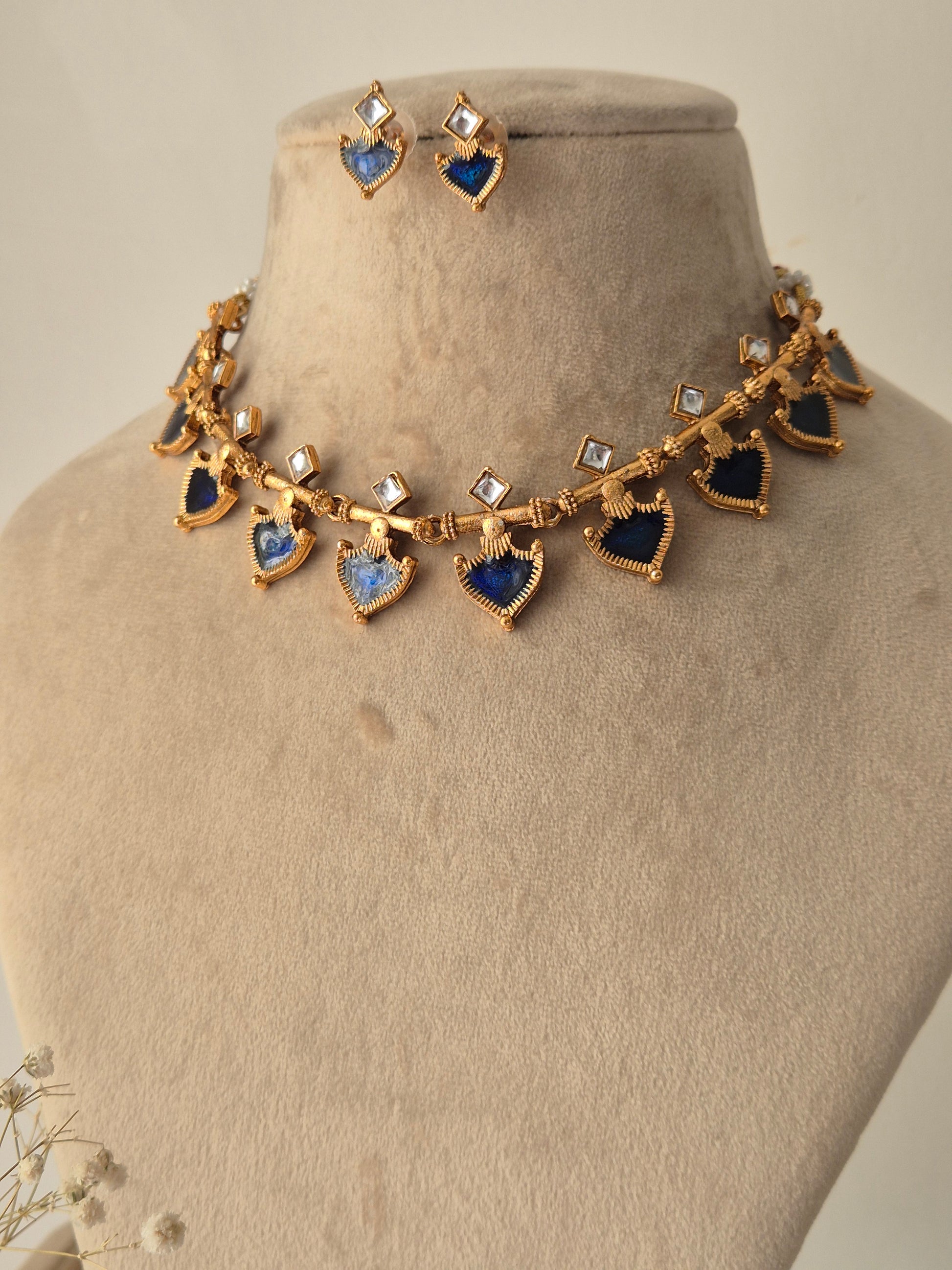 Fiya necklace and earring set with blue coloured and clear square shaped stone by naitri.in