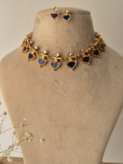 Decorative necklace with blue and gold elements and small square stones by naitri.in