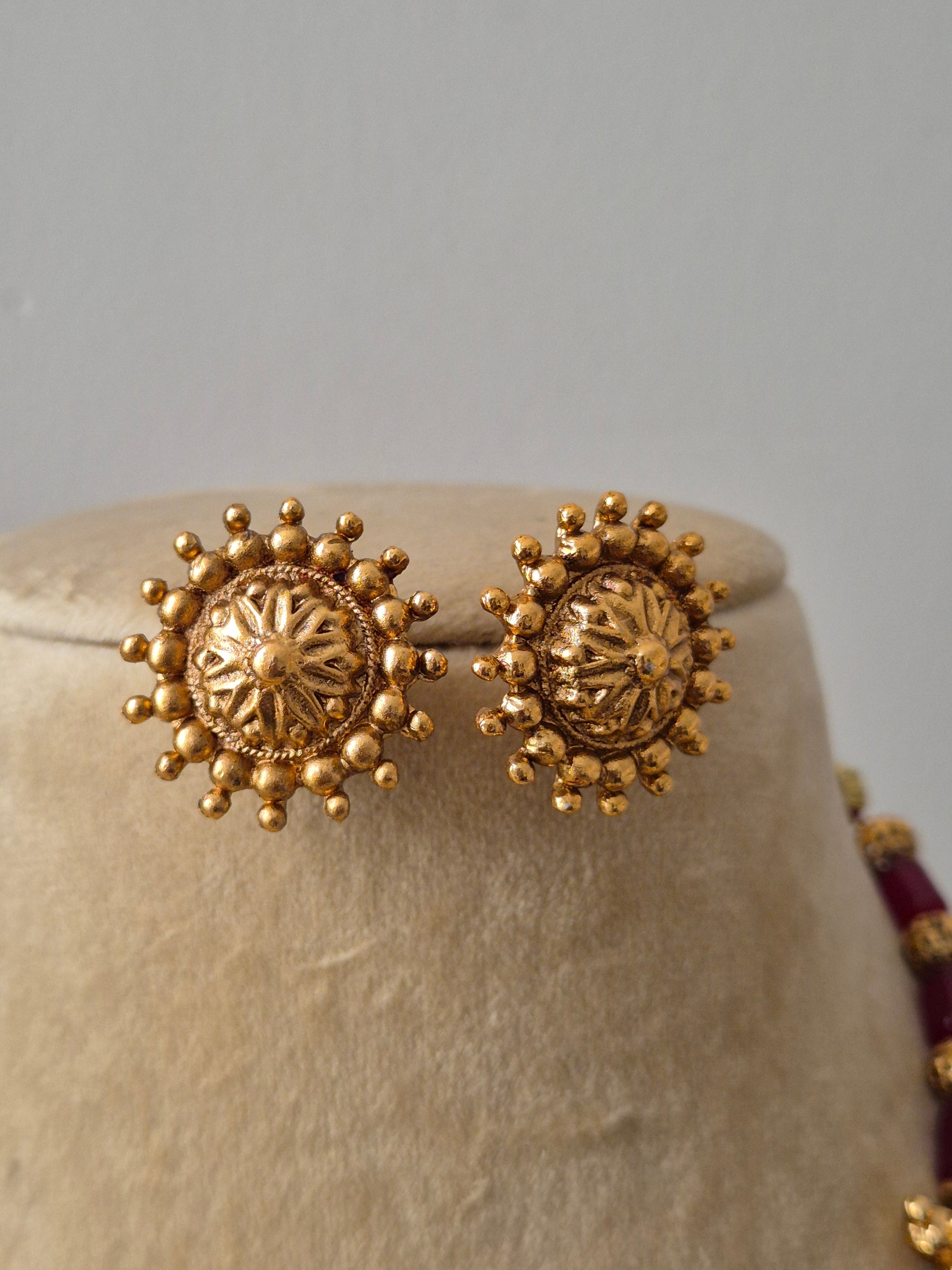 gold-toned and circular stud earrings by naitri.in