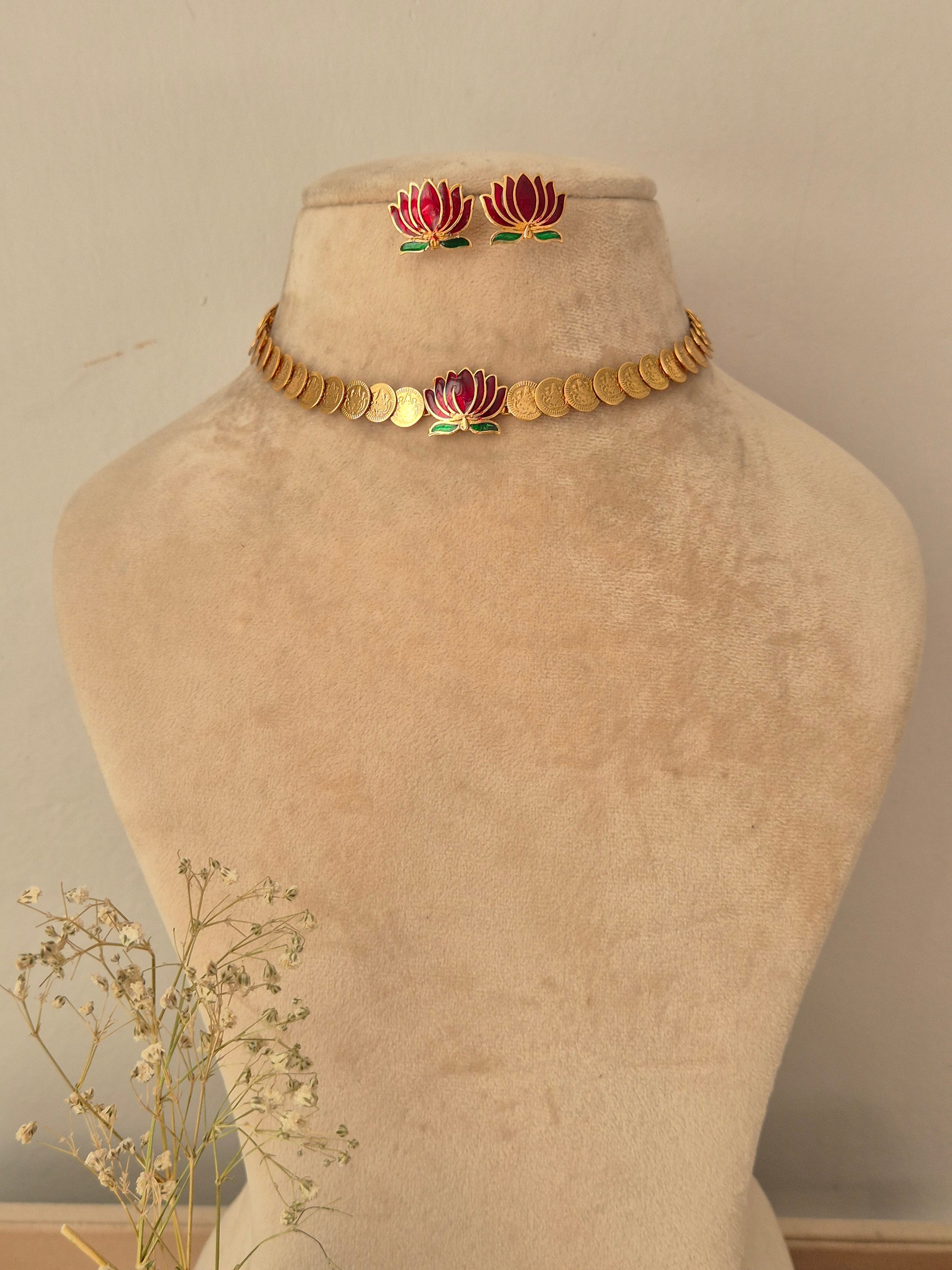 Gold-tone ethnic choker necklace set with lotus flower motif and matching stud earring by naitri.in