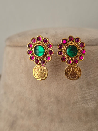 ntique gold traditional Indian with central emerald green stone, ruby red accents, hanging pearl drops by naitri.in
