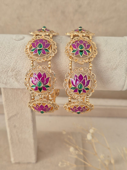Set of two pink lotus motif gold-plated bangles by naitri.in