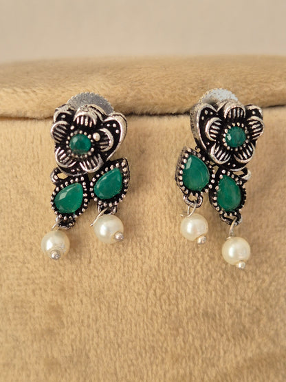 Pair of oxidized silver floral motif earrings green stone oxidized silver earrings  with dangling mini pearls by naitri.in
