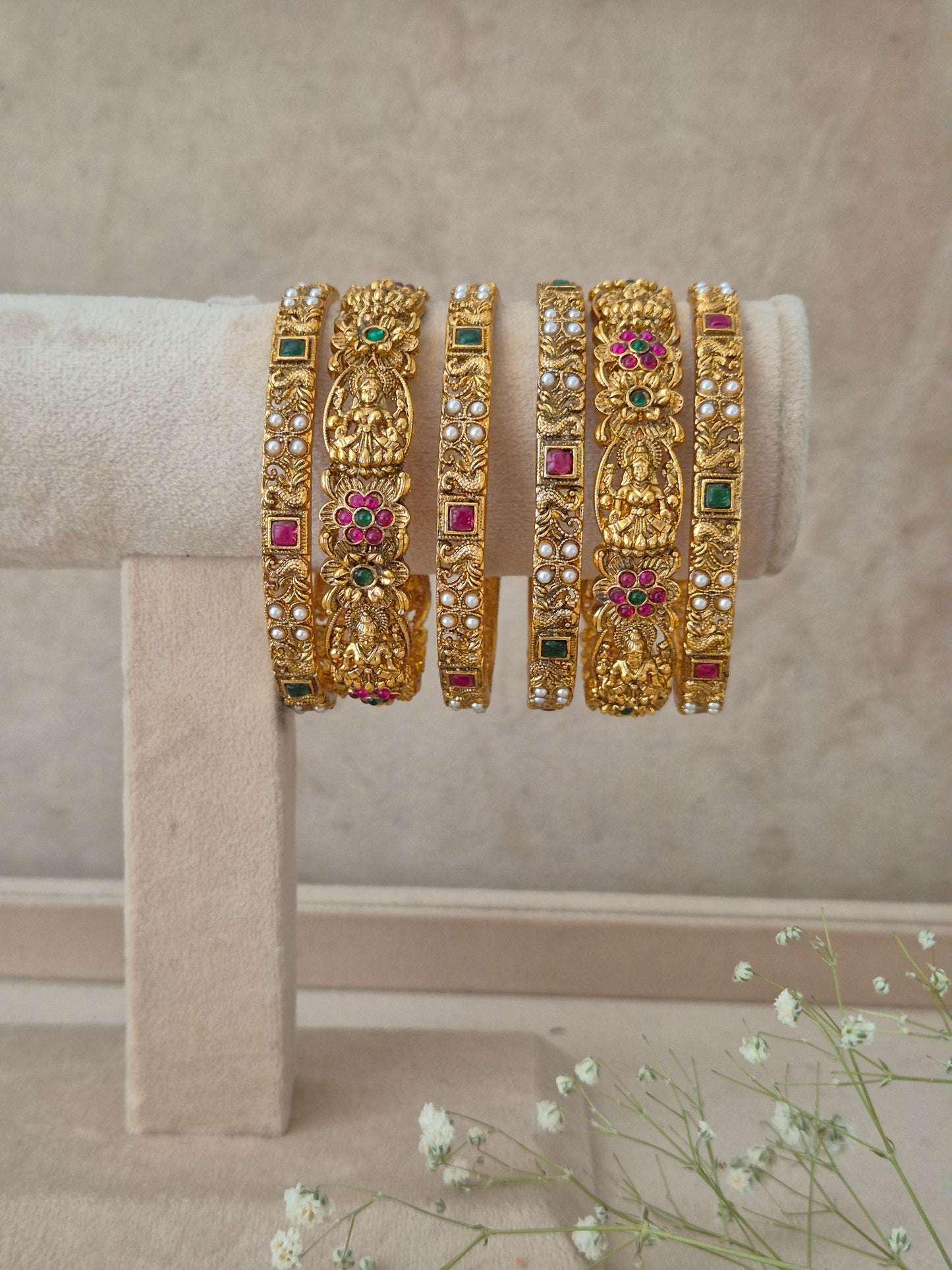  Antique gold-plated ethnic temple jewelry bangles with red and green stone detailing, Antique gold traditional Indian bangle set of 6 studded with red and green stones and temple motifs by naitri.in