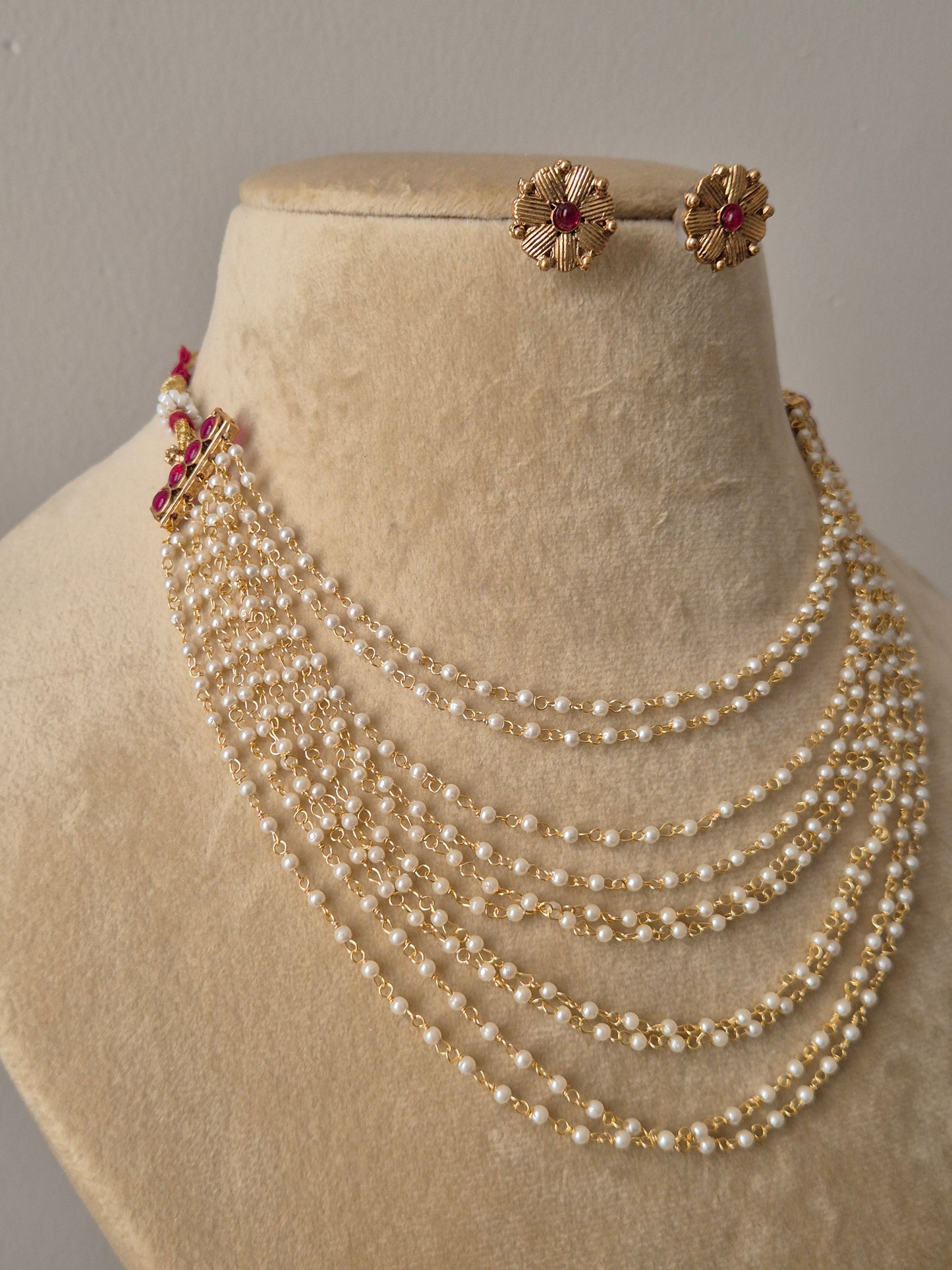  ten-strand pearl necklace and matching gold floral studs by naitri.in