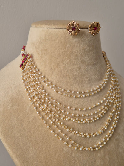  ten-strand pearl necklace and matching gold floral studs by naitri.in