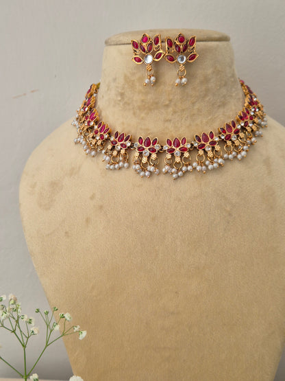 Elegant red gemstone and gold-toned ethnic choker necklace set, Hemangini necklace and earring set with red and white stones by naitri.in