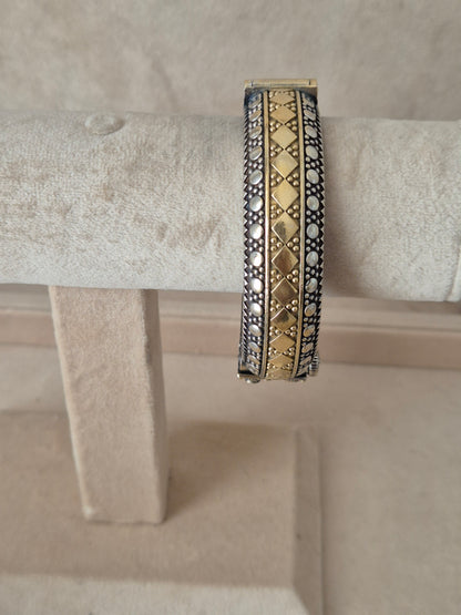 Detailed antique oxidized dual-tone bangle with geometric patterns. by naitri.in