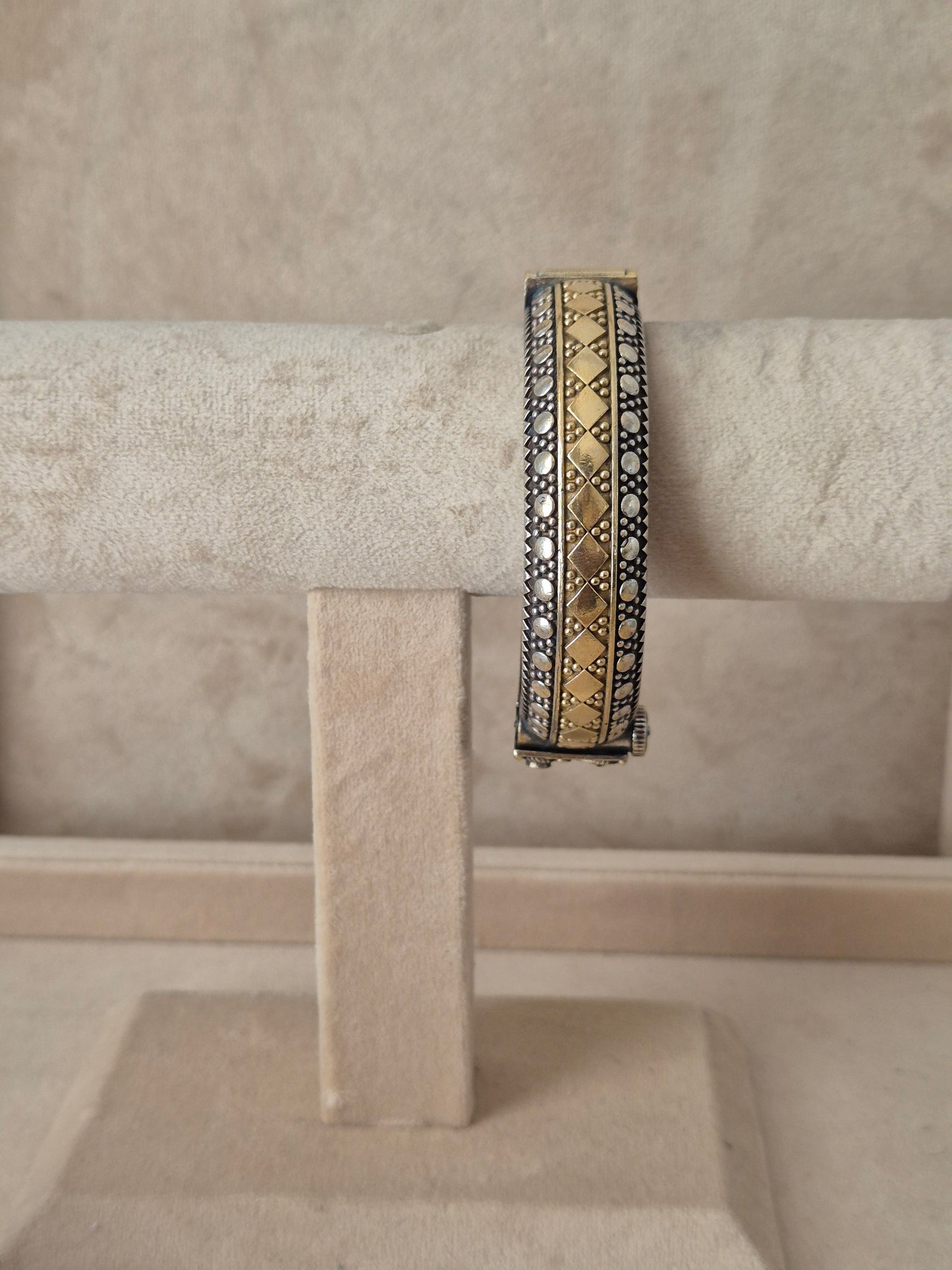 Antique oxidized Hina bangle with a detailed gold geometric diamond pattern by naitri.in