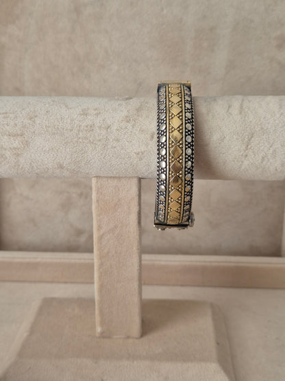 Antique oxidized Hina bangle with a detailed gold geometric diamond pattern by naitri.in