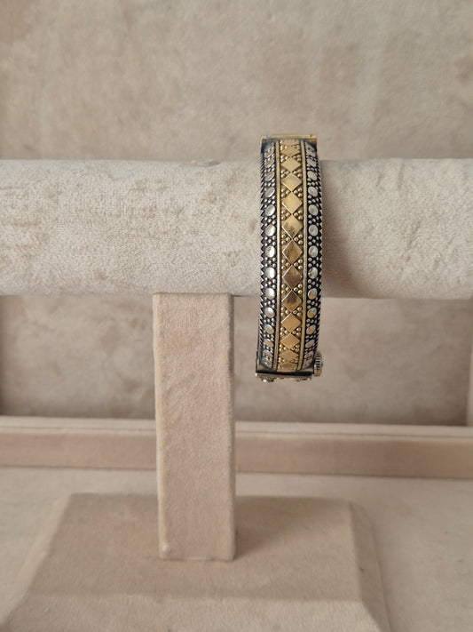 Antique oxidized Hina bangle with a detailed gold geometric diamond pattern by naitri.in
