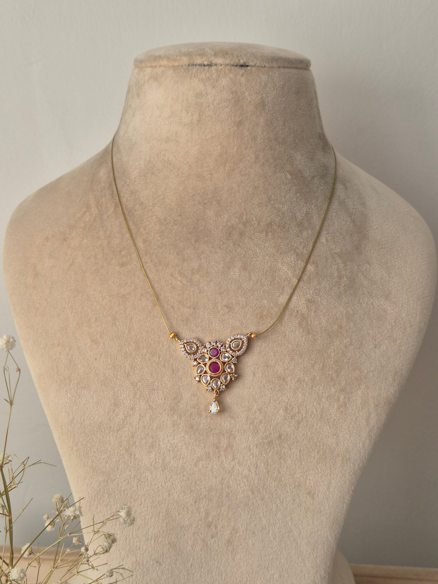 Gold necklace with a star-shaped pendant  invisible chain light weight elegant and minimal jewellery set by naitri