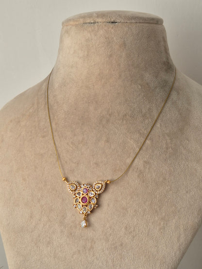 golden necklace and small stones in middle, some small pearls, Timeless, High-quality by naitri.in