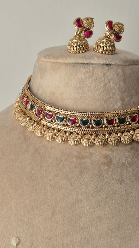 Traditional Indian Gold Jewellery Set with Red-Green Stones and Matching Earrings by naitri.in