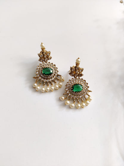 Elegant temple necklace with gold and green details, showcased with focus on delicate metalwork