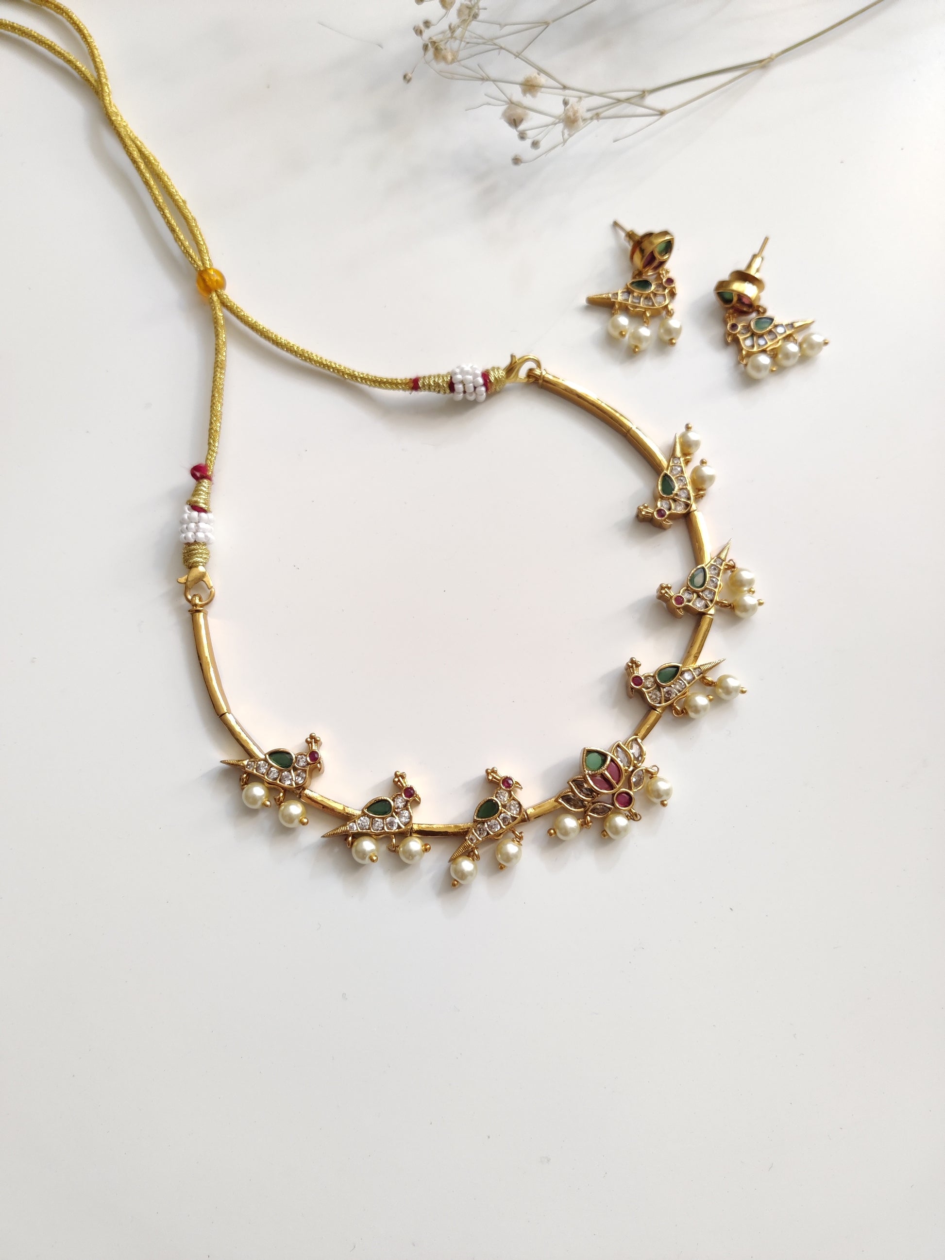 Classic gold-tone necklace set in metal alloy, photographed to highlight smooth finish and traditional look