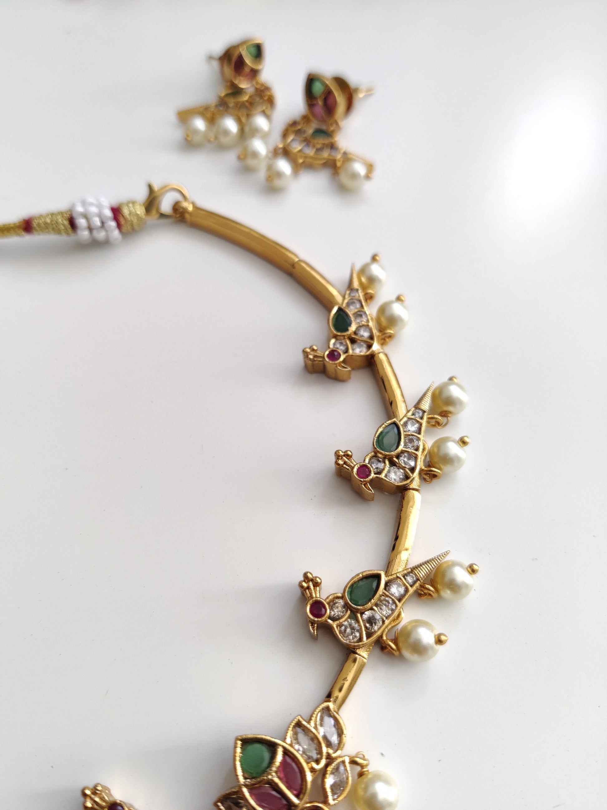 Classic gold-tone necklace set in metal alloy, photographed to highlight smooth finish and traditional look