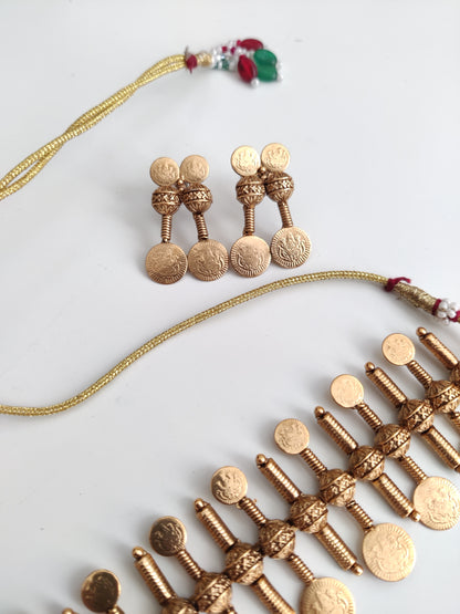 Refined temple necklace set in metal alloy with gold accents, displayed to showcase intricate detailing