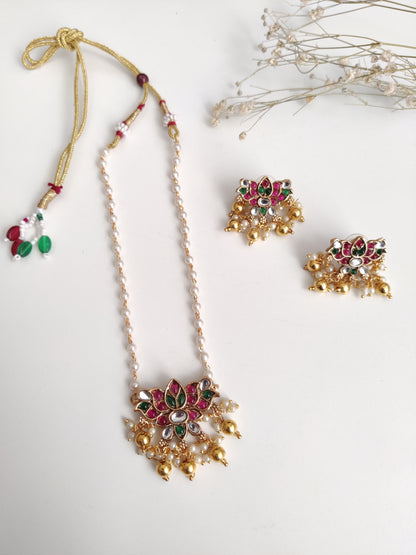 Temple necklace set with stud and dangle elements in gold-tone metal alloy, emphasizing detailed craftsmanship