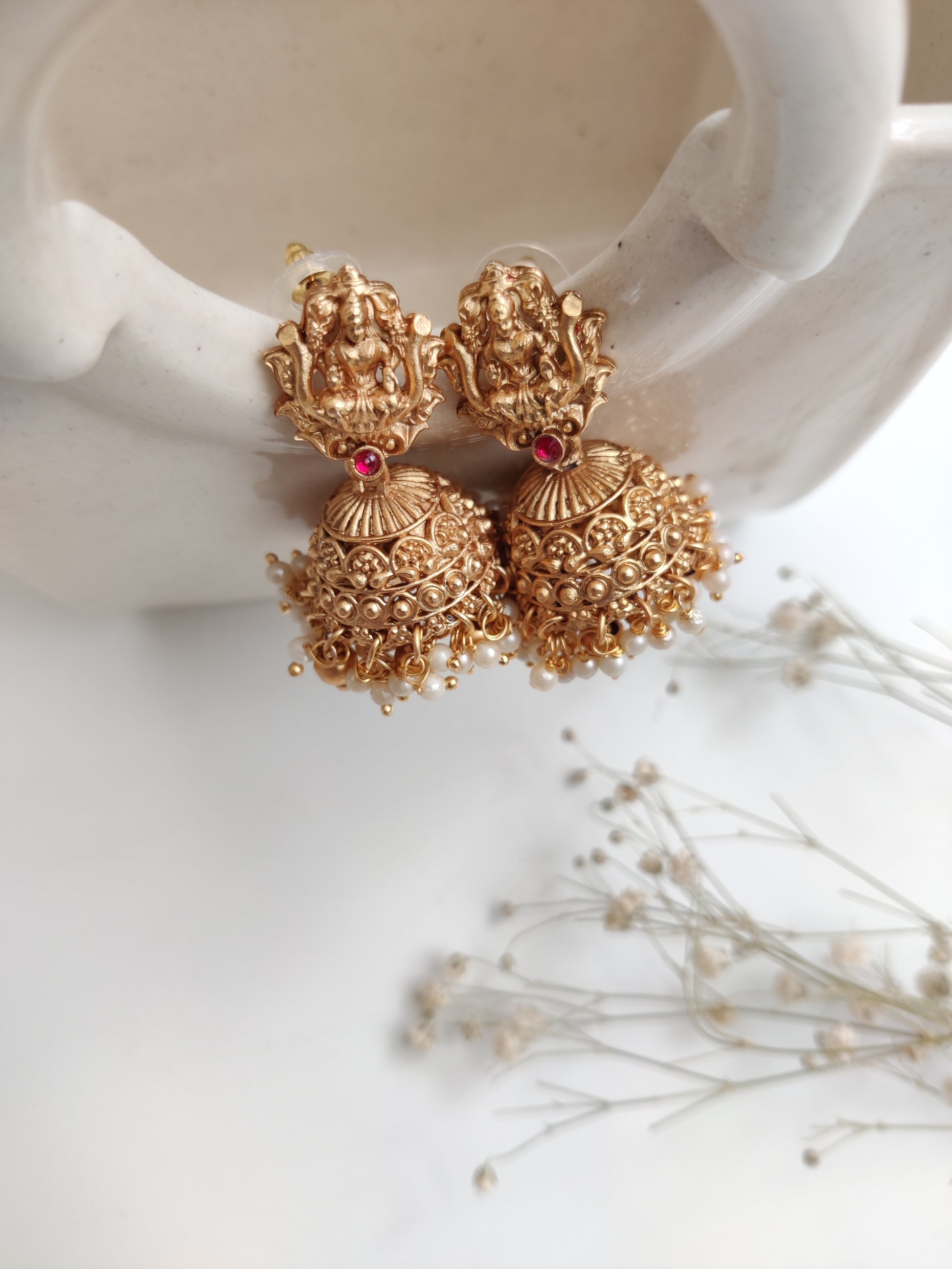 Distinctive temple necklace set blending bronze and gold tones, photographed to emphasize artisanal details