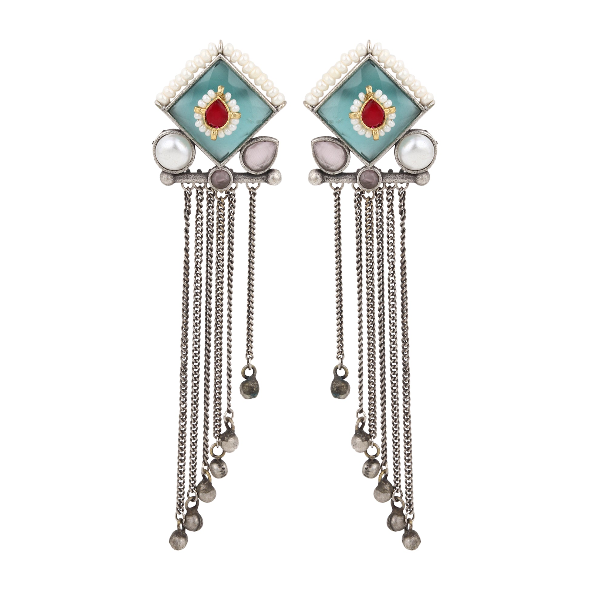 Green and blue stud earrings, Isharya by Naitri on plain display card.