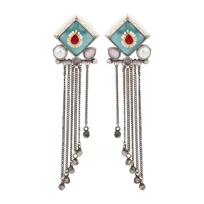 Green and blue stud earrings, Isharya by Naitri on plain display card.