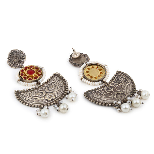 Silver-tone stud earrings, intricate oxidized design, shown on white background