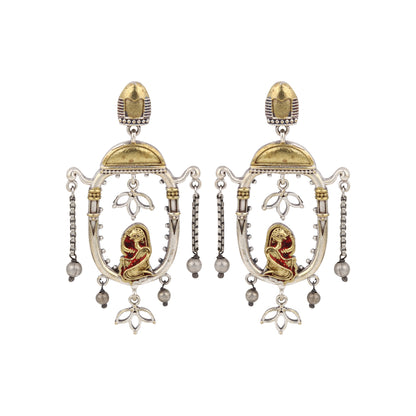 Red and gold stud earrings with bold stone embellishments