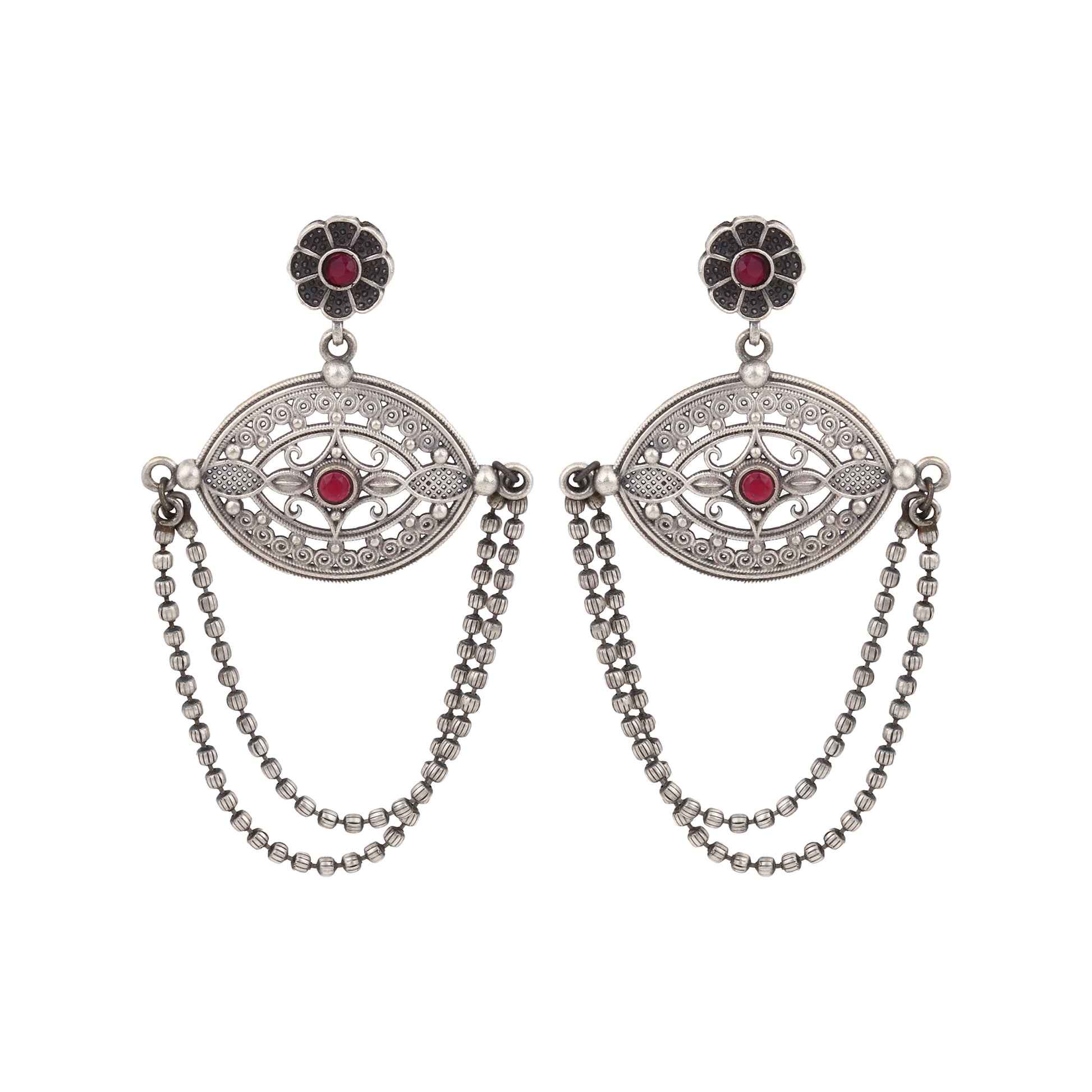 Silver-tone, traditional brass stud earrings shown on dark background