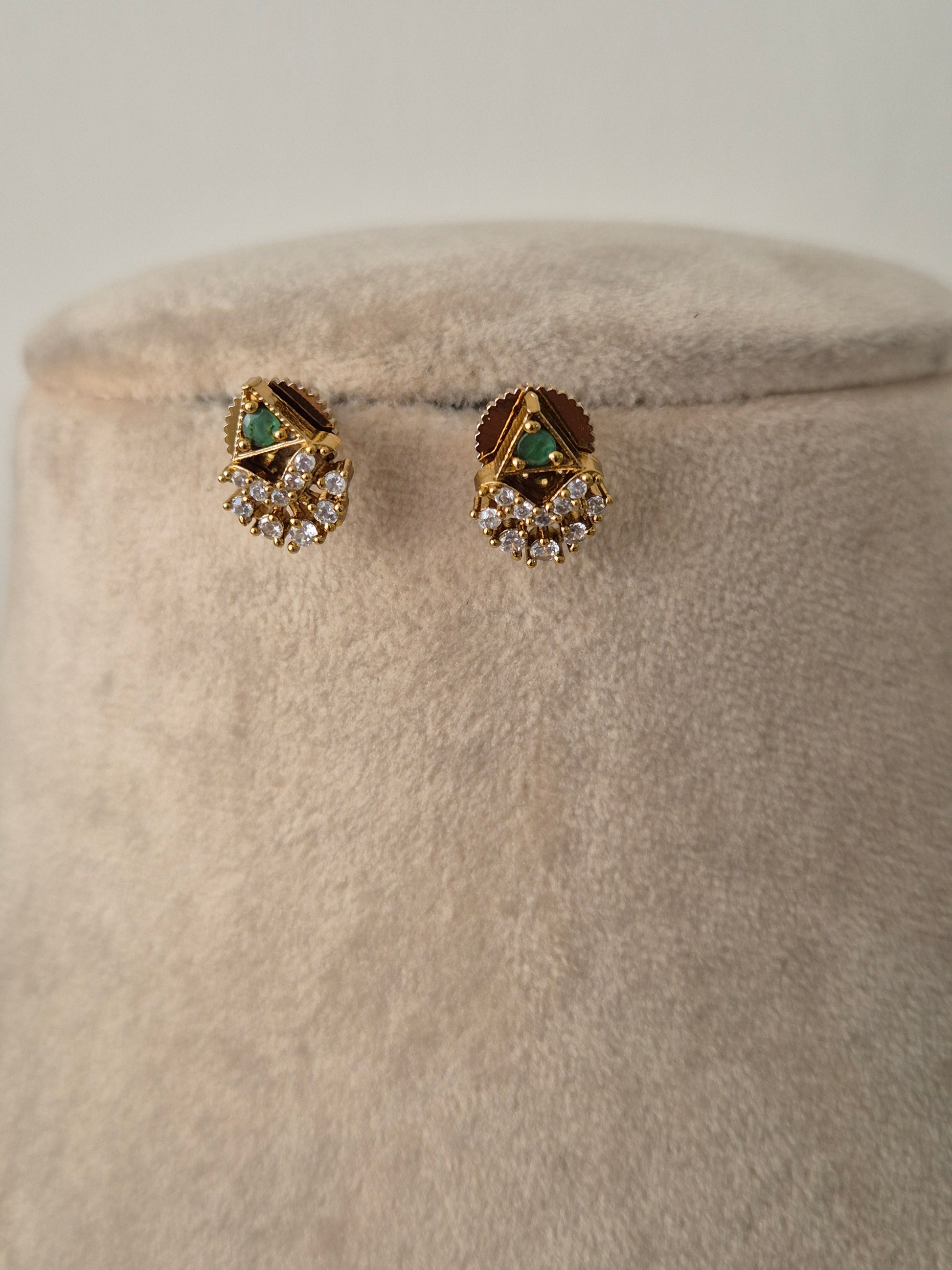 Pair of gold earrings with green gemstones minimal and elegant design by naitri.in