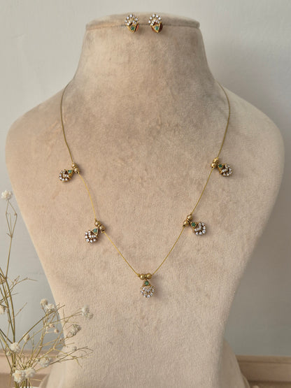 Delicate necklace with floral pendants invisible chain light weight elegant and minimal jewellery set by naitri