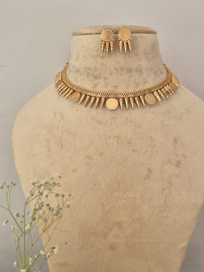 Gold-toned choker necklace and matching round button earrings set  the necklace features an intricate textured chain design adorned with alternating small vertical bar accents and flat circular gold-toned coins by naitri.in