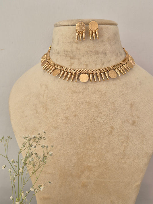 Gold-toned choker necklace and matching round button earrings set  the necklace features an intricate textured chain design adorned with alternating small vertical bar accents and flat circular gold-toned coins by naitri.in