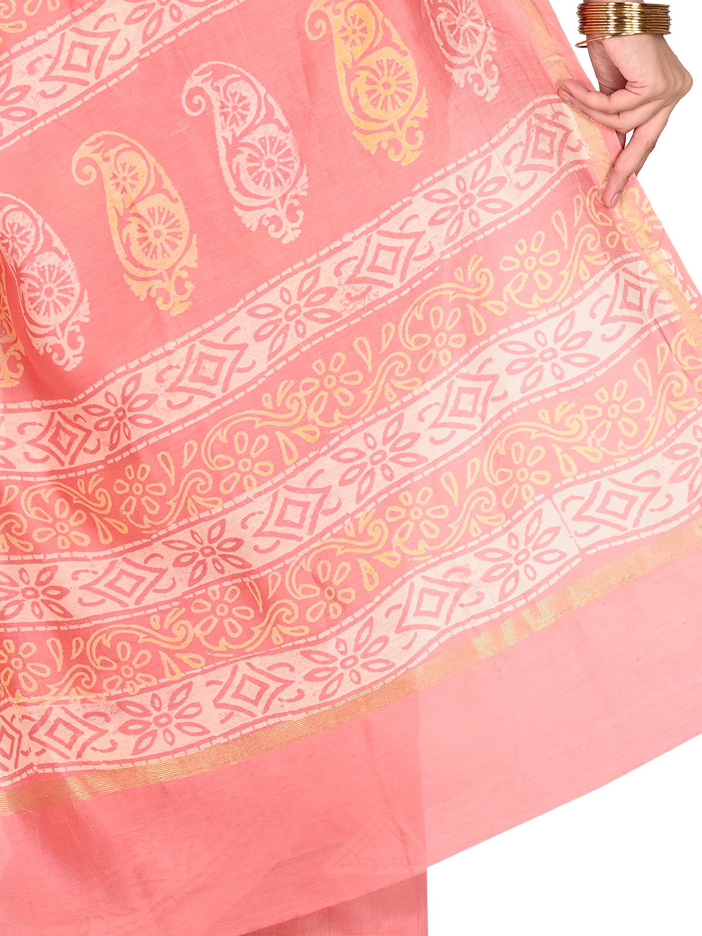 Close-up of a soft peach cotton-silk saree with white traditional block prints and a subtle silk sheen, showing the elegant drape and craftsmanship pallu by naitri.in